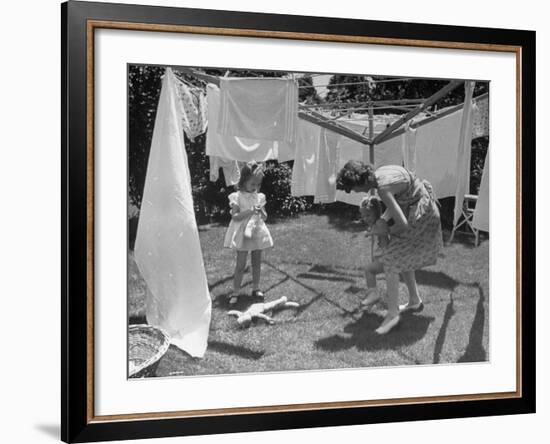 Suburban Mother Playing with Her Two Daughters While Hanging Laundry in Backyard-Alfred Eisenstaedt-Framed Photographic Print