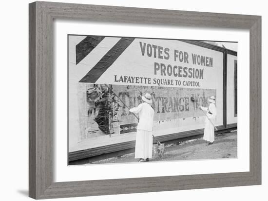 Suffragettes Uses Long Brushes To Post a Billboard Announcing a "Votes" For Women" Parade-null-Framed Art Print