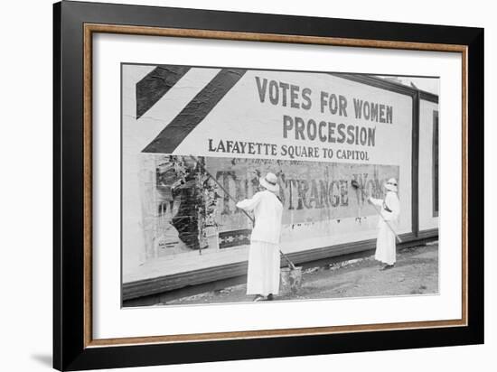 Suffragettes Uses Long Brushes To Post a Billboard Announcing a "Votes" For Women" Parade-null-Framed Art Print