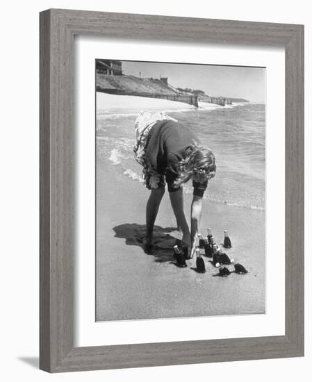 Summer at Cape Cod: Bottles of Coca Cola Buried in the Surf to Keep Them Cool-Alfred Eisenstaedt-Framed Photographic Print