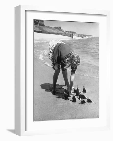 Summer at Cape Cod: Bottles of Coca Cola Buried in the Surf to Keep Them Cool-Alfred Eisenstaedt-Framed Photographic Print