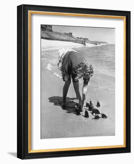 Summer at Cape Cod: Bottles of Coca Cola Buried in the Surf to Keep Them Cool-Alfred Eisenstaedt-Framed Photographic Print