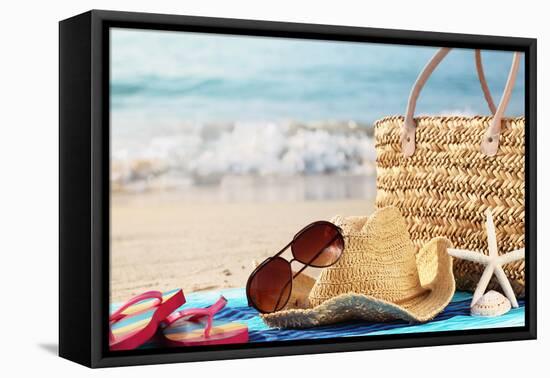 Summer Beach Bag with Straw Hat,Towel,Sunglasses and Flip Flops on Sandy Beach-Sofiaworld-Framed Premier Image Canvas