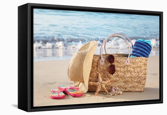 Summer Beach Bag with Straw Hat,Towel,Sunglasses and Flip Flops on Sandy Beach-Liang Zhang-Framed Premier Image Canvas