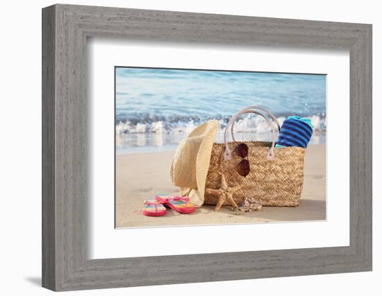 Summer Beach Bag with Straw Hat,Towel,Sunglasses and Flip Flops on Sandy Beach-Liang Zhang-Framed Photographic Print