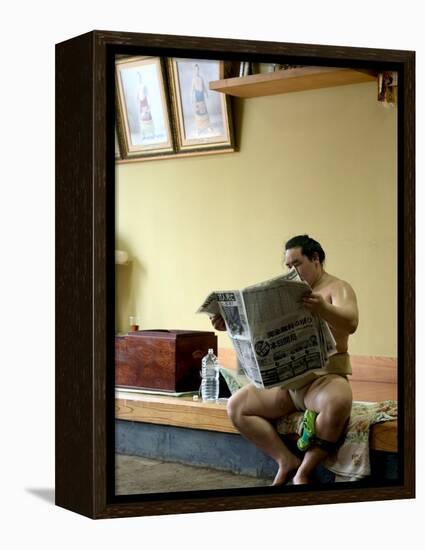 Sumo Wrestler Reading Newspaper, Tokyo City, Honshu Island, Japan-Christian Kober-Framed Premier Image Canvas