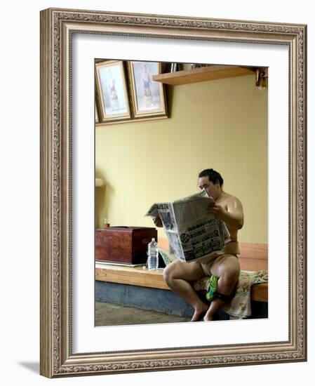 Sumo Wrestler Reading Newspaper, Tokyo City, Honshu Island, Japan-Christian Kober-Framed Photographic Print