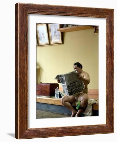 Sumo Wrestler Reading Newspaper, Tokyo City, Honshu Island, Japan-Christian Kober-Framed Photographic Print