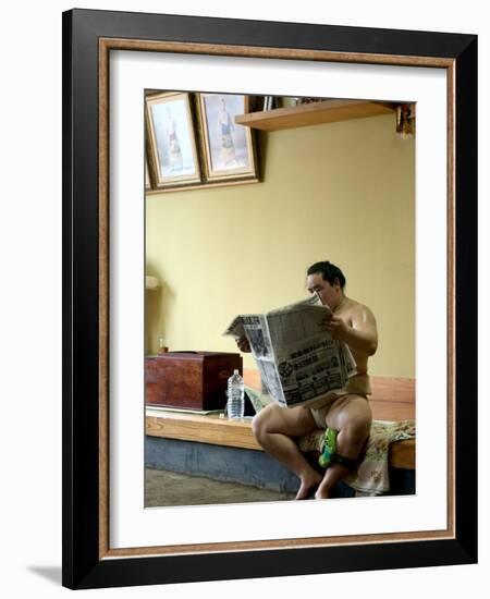 Sumo Wrestler Reading Newspaper, Tokyo City, Honshu Island, Japan-Christian Kober-Framed Photographic Print