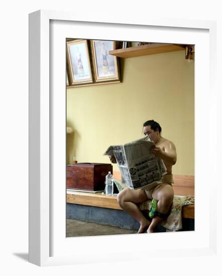 Sumo Wrestler Reading Newspaper, Tokyo City, Honshu Island, Japan-Christian Kober-Framed Photographic Print