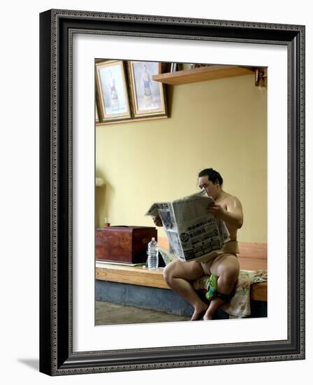 Sumo Wrestler Reading Newspaper, Tokyo City, Honshu Island, Japan-Christian Kober-Framed Photographic Print