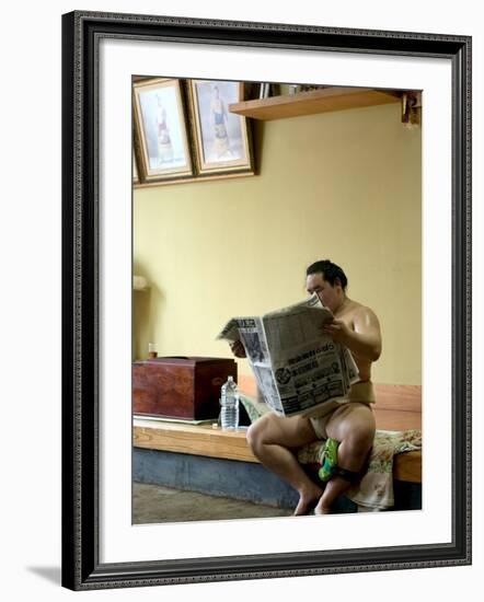 Sumo Wrestler Reading Newspaper, Tokyo City, Honshu Island, Japan-Christian Kober-Framed Photographic Print