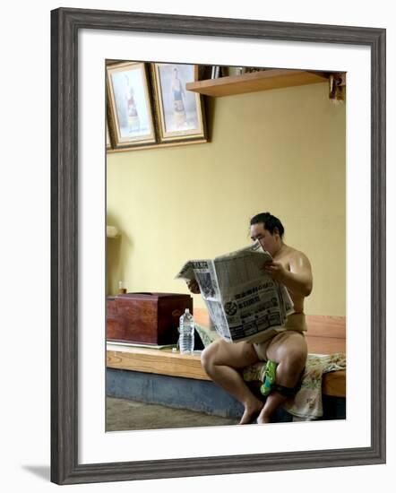 Sumo Wrestler Reading Newspaper, Tokyo City, Honshu Island, Japan-Christian Kober-Framed Photographic Print