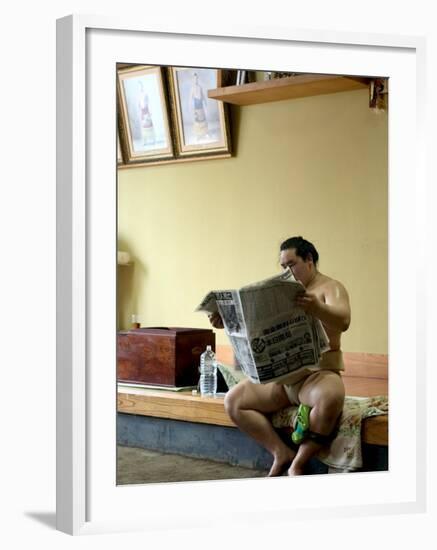 Sumo Wrestler Reading Newspaper, Tokyo City, Honshu Island, Japan-Christian Kober-Framed Photographic Print