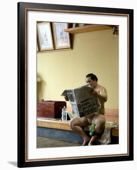 Sumo Wrestler Reading Newspaper, Tokyo City, Honshu Island, Japan-Christian Kober-Framed Photographic Print