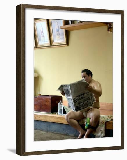 Sumo Wrestler Reading Newspaper, Tokyo City, Honshu Island, Japan-Christian Kober-Framed Photographic Print