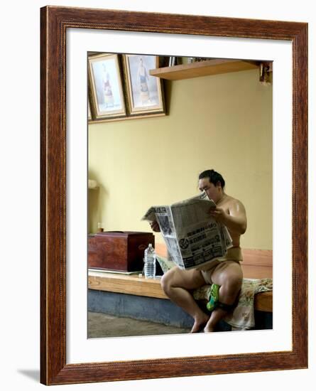 Sumo Wrestler Reading Newspaper, Tokyo City, Honshu Island, Japan-Christian Kober-Framed Photographic Print