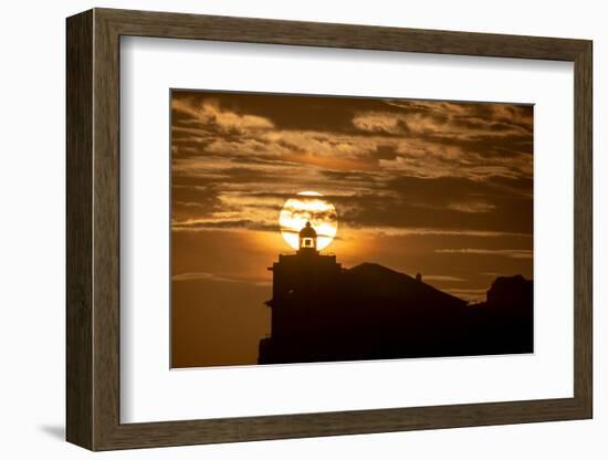 Sun aligned with the silhouette of the lighthouse of Luarca, Asturias, Spain, Europe-Francesco Fanti-Framed Photographic Print