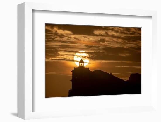 Sun aligned with the silhouette of the lighthouse of Luarca, Asturias, Spain, Europe-Francesco Fanti-Framed Photographic Print