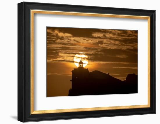 Sun aligned with the silhouette of the lighthouse of Luarca, Asturias, Spain, Europe-Francesco Fanti-Framed Photographic Print