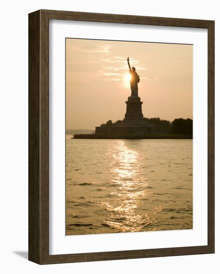 Sun Setting Behind the Statue of Liberty on a Summer Evening-John Nordell-Framed Photographic Print