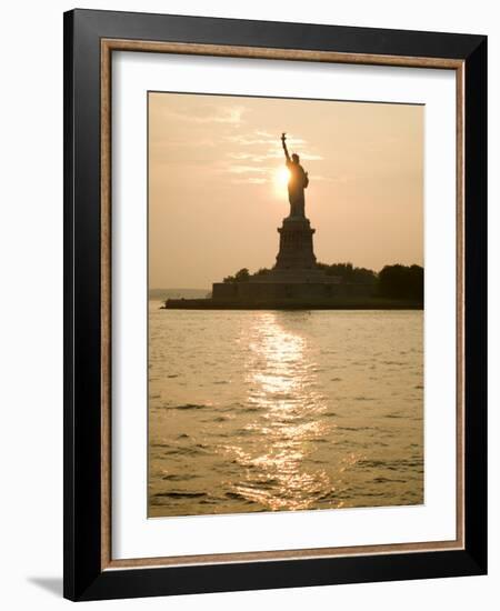 Sun Setting Behind the Statue of Liberty on a Summer Evening-John Nordell-Framed Photographic Print