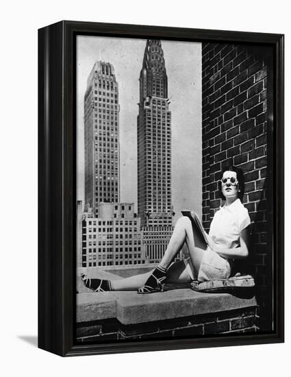 Sunbathing in a Highrise in New York-null-Framed Premier Image Canvas