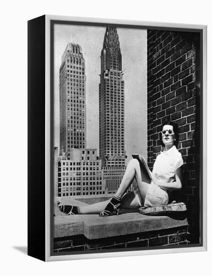 Sunbathing in a Highrise in New York-null-Framed Premier Image Canvas