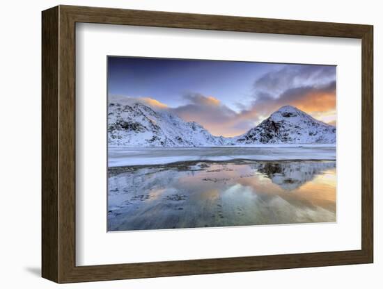 Sunrise on Uttakleiv Beach Surrounded by Snow Covered Mountains Reflected in the Cold Sea-Roberto Moiola-Framed Photographic Print