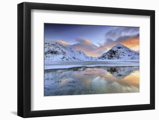 Sunrise on Uttakleiv Beach Surrounded by Snow Covered Mountains Reflected in the Cold Sea-Roberto Moiola-Framed Photographic Print