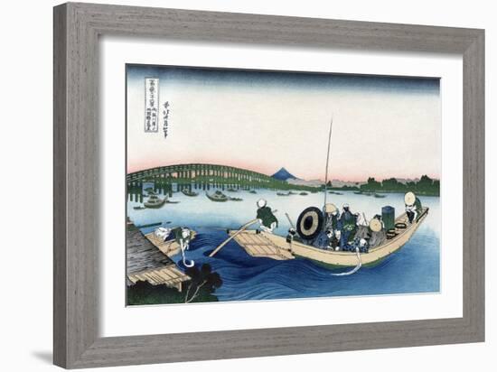 Sunset across Ryogoku Bridge from the Bank of the Sumida River at Onmayyagashi-Katsushika Hokusai-Framed Art Print