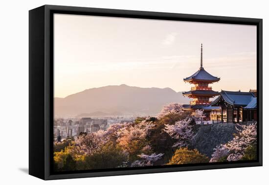 Sunset at Kiyomizu-Dera Temple and Cherry Blossom Season (Sakura) on Spring Time in Kyoto, Japan-thipjang-Framed Premier Image Canvas