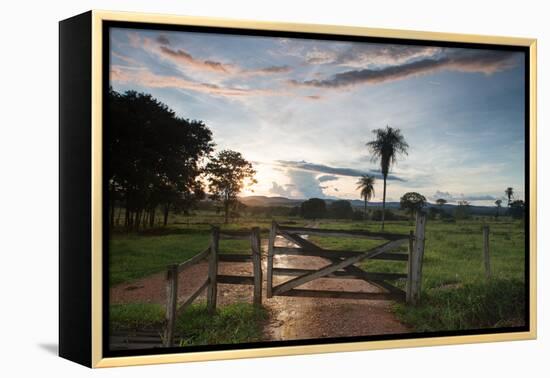 Sunset at the Gate of a Bonito Farm, with Rolling Hills in the Background-Alex Saberi-Framed Premier Image Canvas