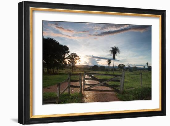 Sunset at the Gate of a Bonito Farm, with Rolling Hills in the Background-Alex Saberi-Framed Photographic Print