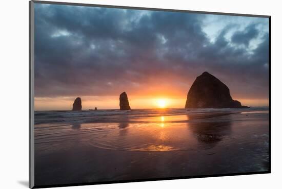 Sunset behind Haystack Rock at Cannon Beach on the Pacific Northwest coast, Oregon, United States o-Martin Child-Mounted Photographic Print