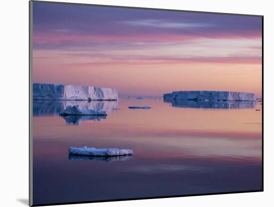 Sunset over tabular and glacial ice near Snow Hill Island, Weddell Sea, Antarctica-Michael Nolan-Mounted Photographic Print