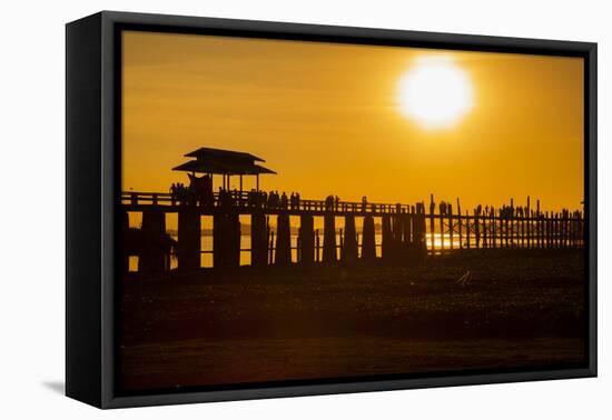 Sunset over the lake near wooden footbridge, Myanmar.-Michele Niles-Framed Premier Image Canvas