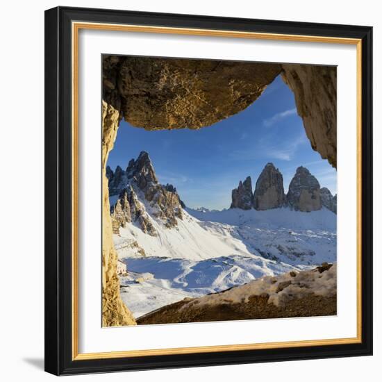 Sunset over the snow capped Tre Cime di Lavaredo and Monte Paterno seen from rock cave-Roberto Moiola-Framed Photographic Print