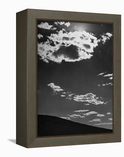 Sunshine Filled Clouds Against Dark Sky, Above Dark Dune in Middle of Kalahan Desert, Bechuanaland-Nat Farbman-Framed Premier Image Canvas