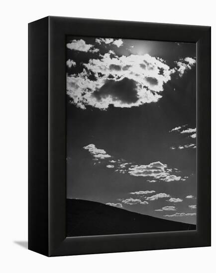 Sunshine Filled Clouds Against Dark Sky, Above Dark Dune in Middle of Kalahan Desert, Bechuanaland-Nat Farbman-Framed Premier Image Canvas