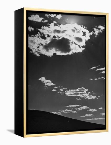 Sunshine Filled Clouds Against Dark Sky, Above Dark Dune in Middle of Kalahan Desert, Bechuanaland-Nat Farbman-Framed Premier Image Canvas