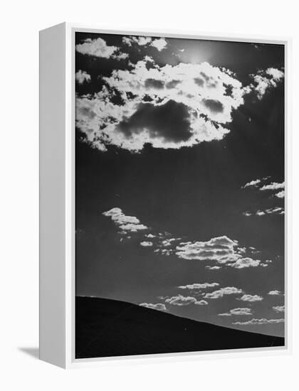 Sunshine Filled Clouds Against Dark Sky, Above Dark Dune in Middle of Kalahan Desert, Bechuanaland-Nat Farbman-Framed Premier Image Canvas