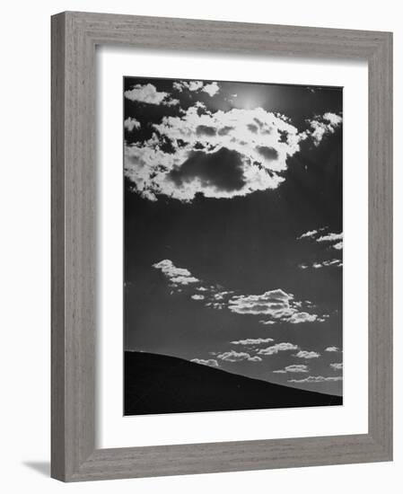 Sunshine Filled Clouds Against Dark Sky, Above Dark Dune in Middle of Kalahan Desert, Bechuanaland-Nat Farbman-Framed Photographic Print