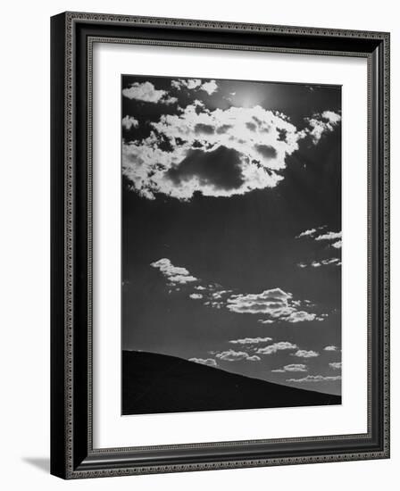 Sunshine Filled Clouds Against Dark Sky, Above Dark Dune in Middle of Kalahan Desert, Bechuanaland-Nat Farbman-Framed Photographic Print