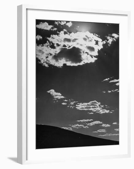 Sunshine Filled Clouds Against Dark Sky, Above Dark Dune in Middle of Kalahan Desert, Bechuanaland-Nat Farbman-Framed Photographic Print