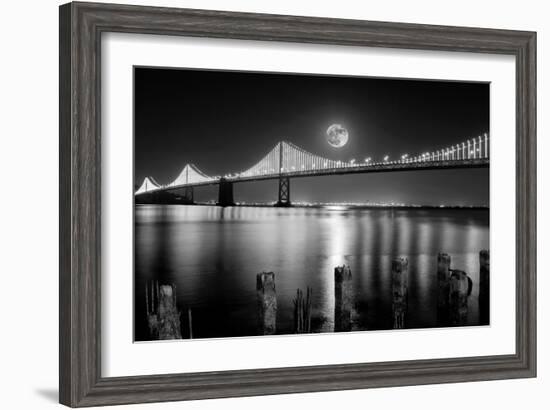 Super full moon rising in San Francisco Embarcadero pier over the Bay Bridge in the evening-David Chang-Framed Photographic Print