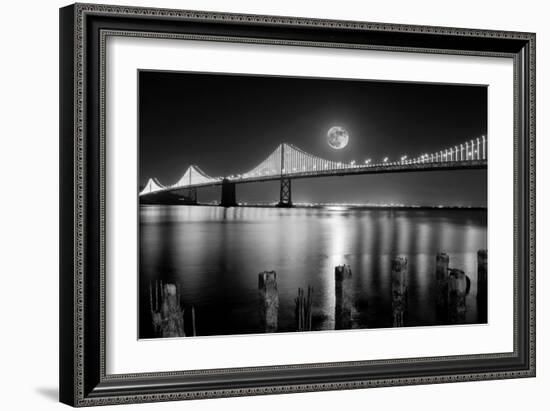 Super full moon rising in San Francisco Embarcadero pier over the Bay Bridge in the evening-David Chang-Framed Photographic Print