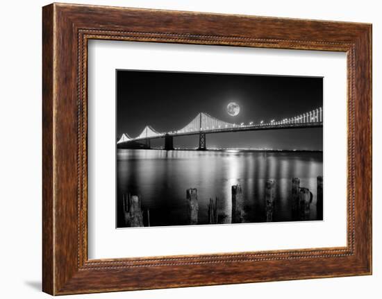 Super full moon rising in San Francisco Embarcadero pier over the Bay Bridge in the evening-David Chang-Framed Photographic Print