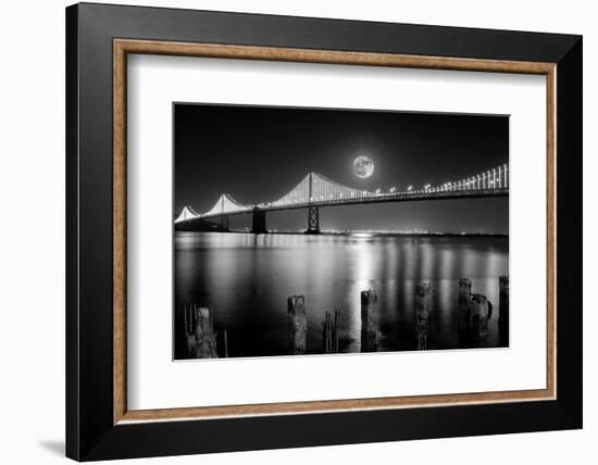 Super full moon rising in San Francisco Embarcadero pier over the Bay Bridge in the evening-David Chang-Framed Photographic Print