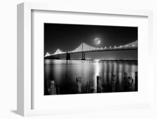 Super full moon rising in San Francisco Embarcadero pier over the Bay Bridge in the evening-David Chang-Framed Photographic Print